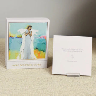 A pack of Hope Scripture Cards featuring an angel illustration on one side and a scripture verse on the other, with a gold and white design, Anne Neilson