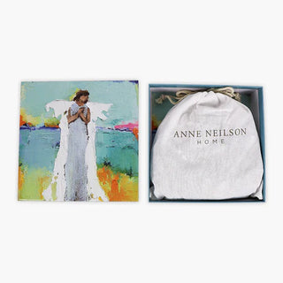 A 500-piece jigsaw puzzle with a colorful artwork depicting an angel, anne neilson, puzzle piece pouch