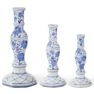 Set of three blue and white ceramic candle holders on a white background. Blue & White Chinoiserie Taper Candleholder Assorted