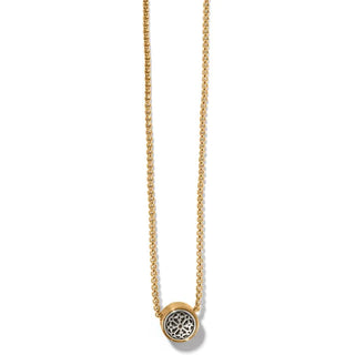 A two-tone gold and silver Brighton Ferrara necklace with an engraved and hammered design, featuring a round locket with a geometric pattern in the center.