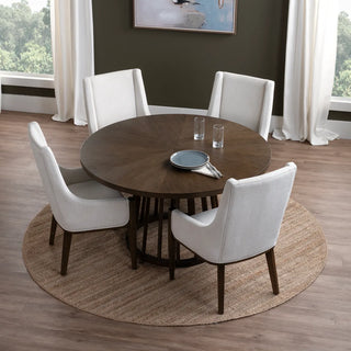 Dining room with a round wooden table and four white chairs on a wooden floor. spindle base Brunswick Dining Table