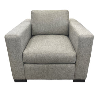 A beige upholstered Burton James Habitat chair with a cushioned backrest and seat, standing on a hidden frame.