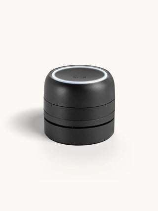 A black, cordless Pura Car Pro diffuser designed for use in vehicles.