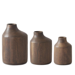 Three wooden vases of different sizes on a white background
