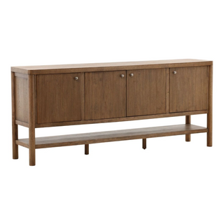 Wooden sideboard with four doors and a shelf on a white background medium stain gold knobs