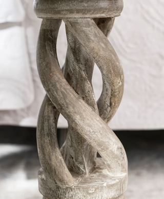 A traditional, round Freeman Accent Table with a twisted trestle base and a dark-brown finish.