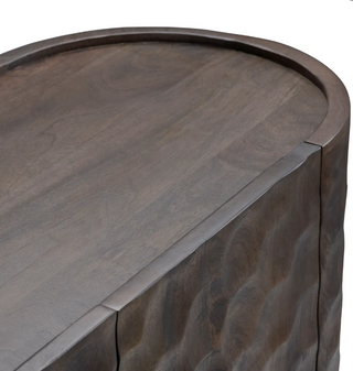 Close-up of the Gibson Four-Door Sideboard showcasing its brown wood finish and honey-comb texture.