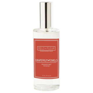 Grapefruit Pomelo fragrance mist bottle with red label on a white background