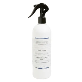 A white spray bottle labeled 'Hillhouse Naturals Lake Side Linen Mist' with a black spray nozzle.