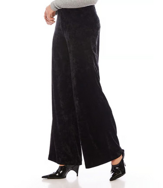 A pair of black crushed velvet pants with a high-rise waist and wide-leg design, featuring an elasticized waistband.