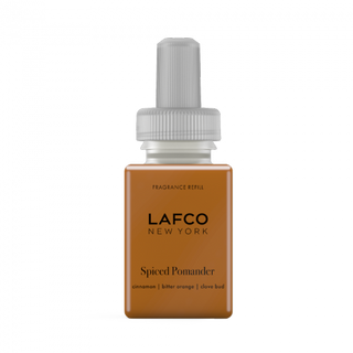 A bottle of LAFCO Spiced Pomander fragrance refill for a Pura diffuser.