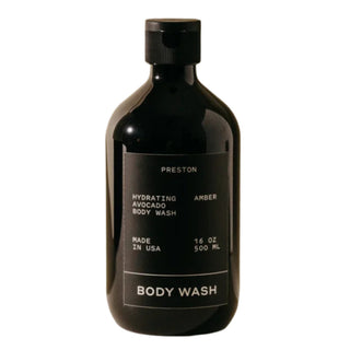 A black bottle of Preston body wash with a simple design, labeled 'Hydrating Amber Body Wash, 16 oz'.