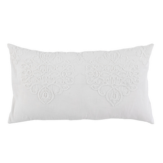 A white cotton king-size pillow with hand embroidered floral design on the front.