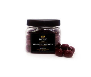 Jar of red velvet cherries with a black lid on a white background milk chocolate