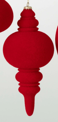 Red Christmas ornament with a textured design on a light gray background