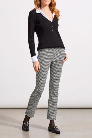 A model wearing Tribal Houndstooth Jacquard Pull On Pant in Black with a micro flare leg and front slash pockets.