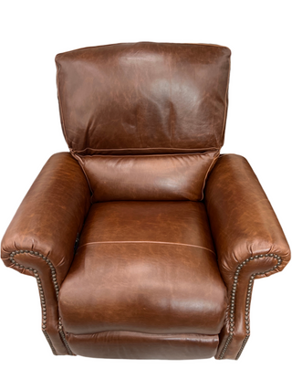 Brown leather armchair on a white background