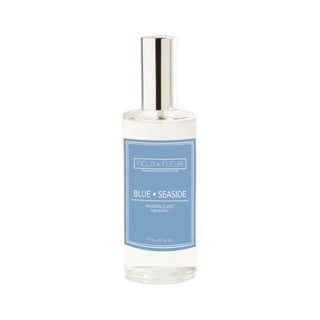 A clear glass bottle of Hillhouse Naturals Blue Seaside Fragrance Mist with a blue label.