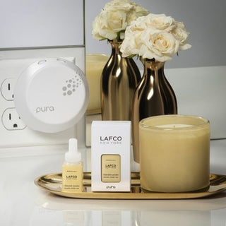 LAFCO Chamomile Lavender Pura Diffuser inserts next to Chamomile Lavender candle