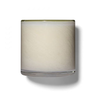 A LAFCO Feu de Bois candle in a  glass holder with a green tint at the top.