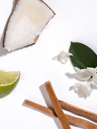 A Pura fragrance vial refill with its packaging, in a light mint green color with floral graphics, the product is labeled 'Linens & Surf'.