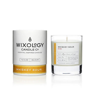 A cocktail-inspired candle with a white label that reads 'Wixology Candle Co., Whiskey Sour'.