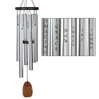 A teak finish ash wood wind chime with six silver silk-screened aluminum tubes with Amazing Grace How Sweet the Sound on each chime.