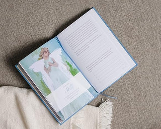 Anne Neilson's Angels Guided Journal. Open book with a photograph of an angel