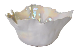 Antigua Bowl Assorted
An organic-shaped white ceramic bowl with a wavy, scalloped rim and an iridescent pearlescent finis