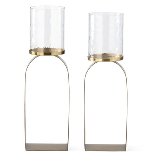 Two gold and glass candle holders on a white background. Antiqued Gold & Glass Hurricane Candleholder 