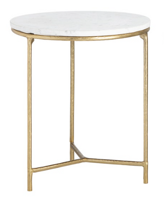 A contemporary style end table with a round white marble top and three gold metal legs.