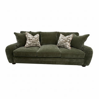 Bedford Sofa in Green
An olive green three-seater sofa, styled with two patterned throw pillows.