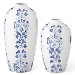 Two white vases with blue floral patterns on a white background