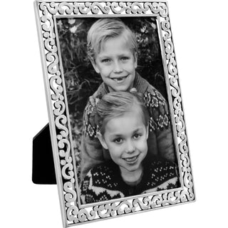 A silver-colored picture frame with a decorative border, designed to hold a 4x6 picture. Brighton