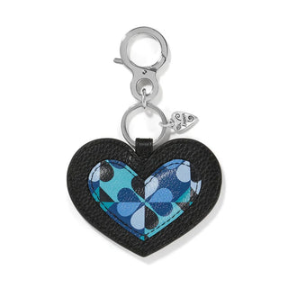 A heart-shaped leather handbag fob with a moody blue and black design and a metal hook.