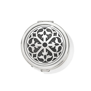 A round, silver-plated Brighton Ferrara pill box with a floral and geometric pattern on the lid.