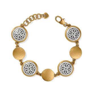 A two-tone (gold and silver) bracelet with engraved and hammered designs, featuring a mix of geometric and floral patterns, and a silversmith flair. Brighton