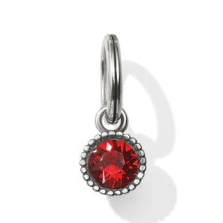 A red faceted crystal amulet with a metallic ring on top for attachment. Brighton