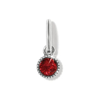 A red faceted crystal amulet with a metallic ring for attachment. Brighton