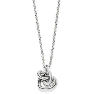 Silver necklace with a knot pendant on a white background. Brighton
