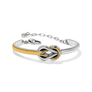 A two-tone bar bracelet with a silver and gold finish, featuring a lobster claw closure. Brighton