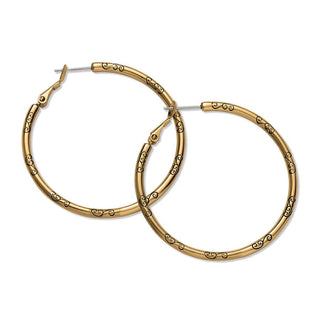 A pair of gold-plated hoop earrings with charm details. Brighton