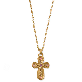 A gold-colored adjustable necklace with a reversible cross pendant. Brighton