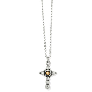 A Brighton Majestic Nobel Cross Reversible Necklace silver reversible necklace featuring a hammered bead detail and a gold domed center, with white hand-enamel on the backside.