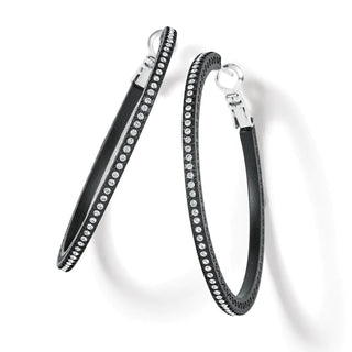 A pair of black large hoop earrings with crystal pave details. Brighton