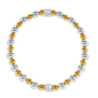 A silver and gold stretch bracelet featuring a series of round beads and a single larger bead with a crystal in the center. Brighton