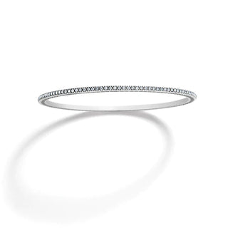 A silver-plated bangle bracelet with fine crystal pave details. Brighton