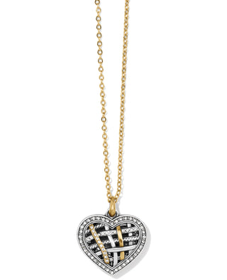 A gold-colored necklace featuring a heart-shaped pendant with multiple bands of inset stones. Brighton Neptune's Rings Convertible Reversible Heart Necklace