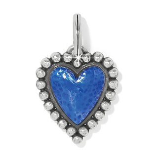 A silver-plated, hand-enameled heart charm with a blue enamel center and a beaded frame, on a chain.