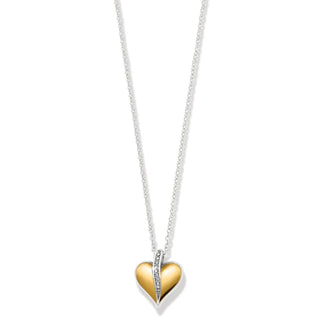 A two-tone petite necklace with a heart-shaped pendant in gold and silver colors, on an adjustable silver chain. Brighton